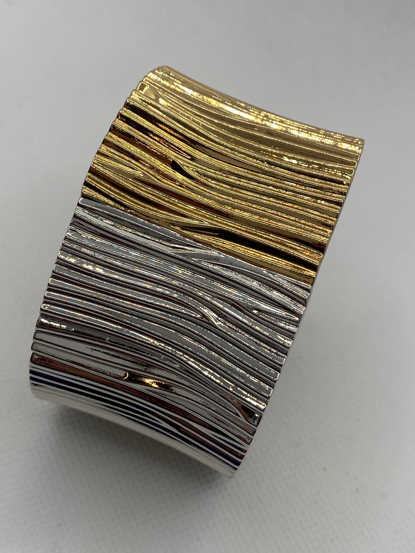 Gold and silver rigid bracelet