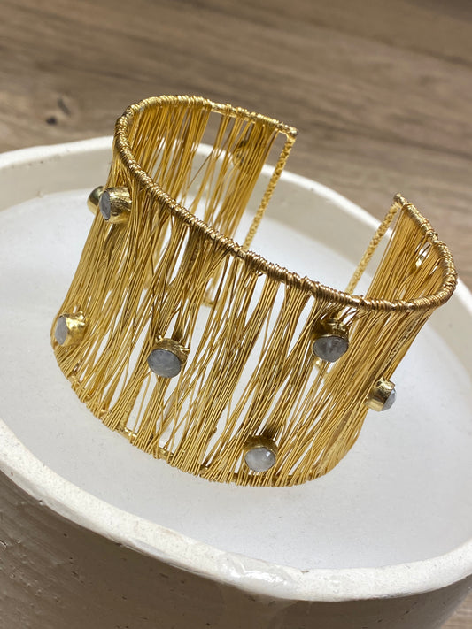 Golden bracelet with stones